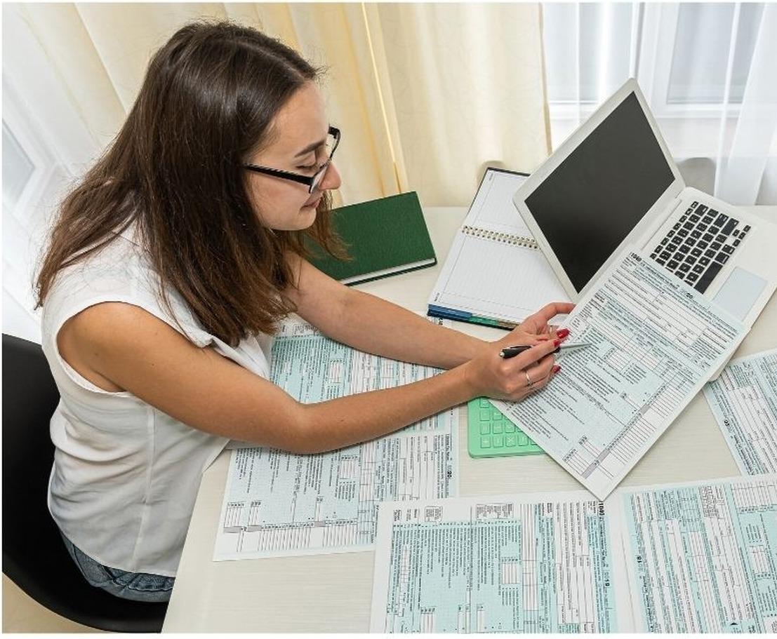 Tax professionals reviewing client tax documents